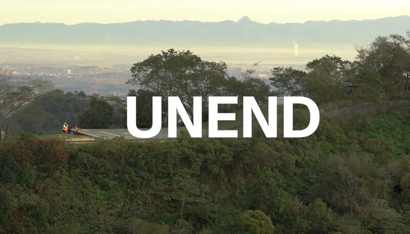 Promotional image with the UNEND logo over a green view of Rio and two runners on a road